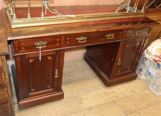 An Edwardian inlaid mahogany pedestal desk W.140cm